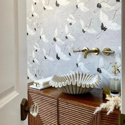 Handcrafted marble sink placed on countertop