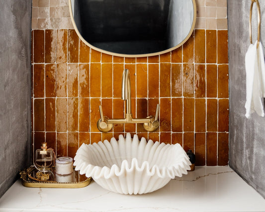 White marble bathroom sink in modern vanity